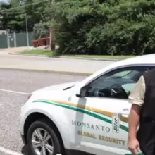 “Global Monsanto Security Team” Attempts to Remove Reporters from Public Sidewalk