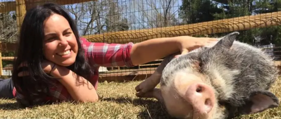 Jon's wife Tracey with one of their rescued pigs.