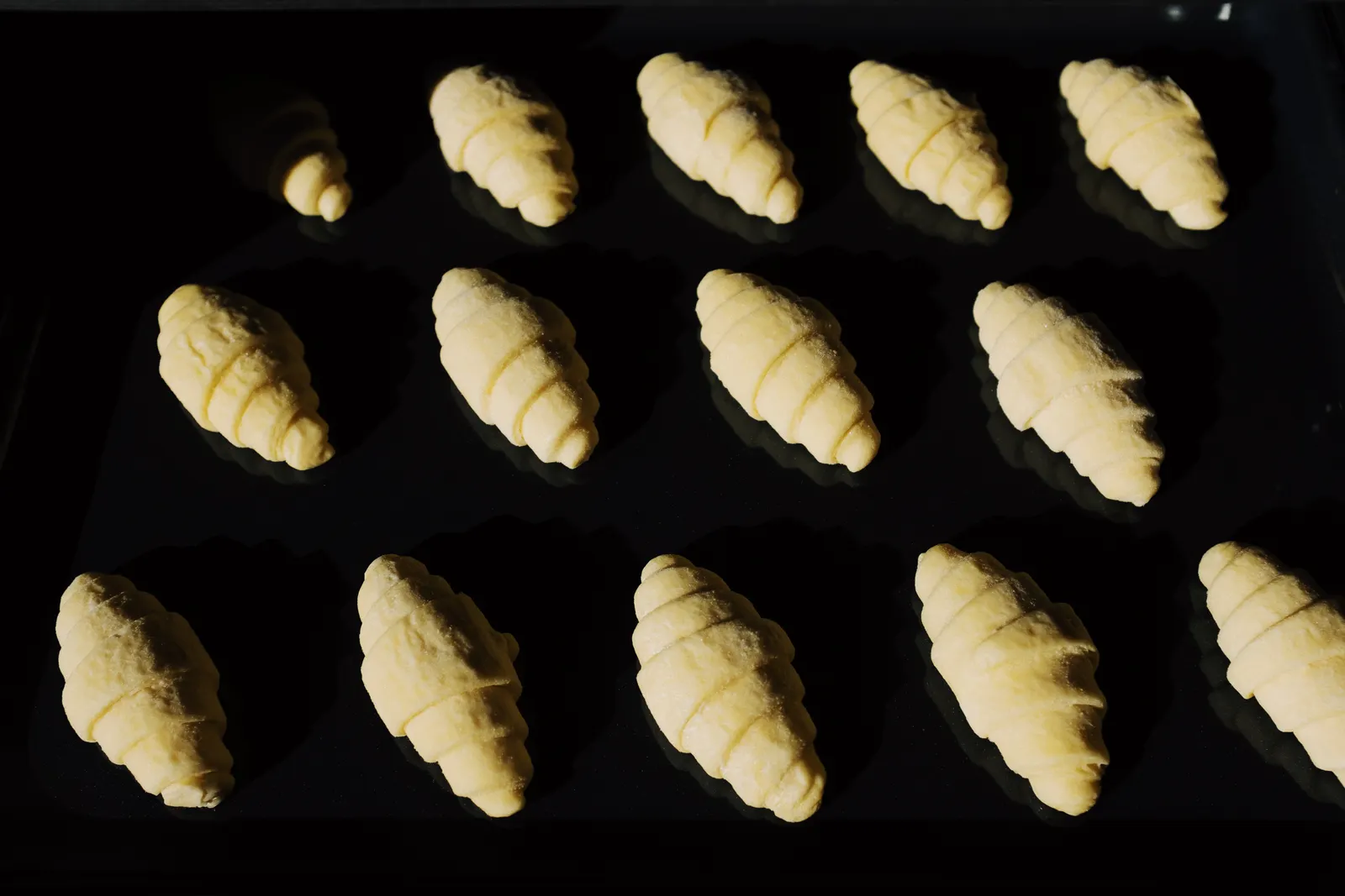 Croissants on a tray before baking
