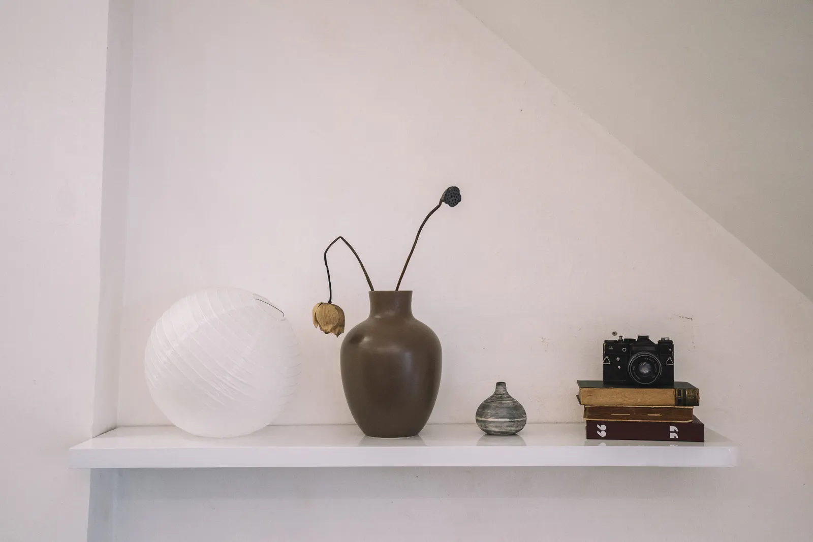 Shelf with ceramics and a vase