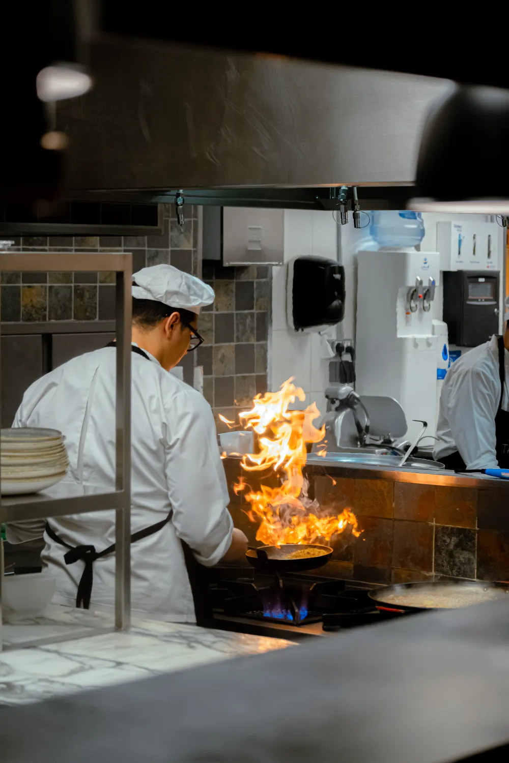 Chef working over open flames
