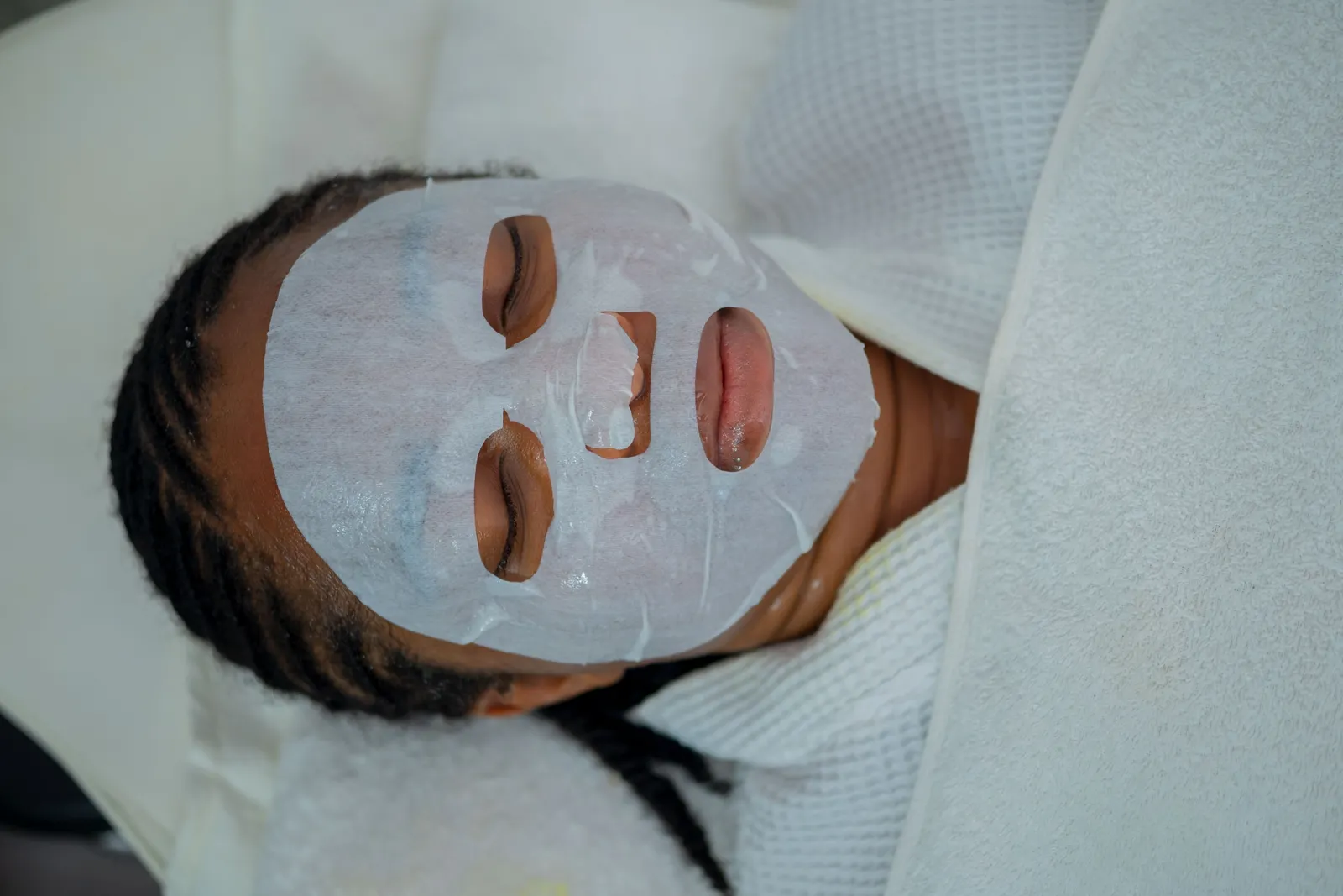 Guest with a clay mask during a facial