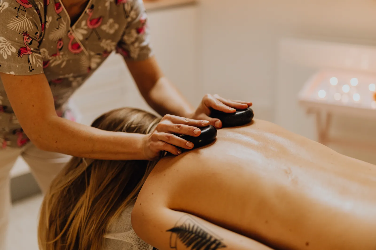 Hot stones placed along the back during a massage